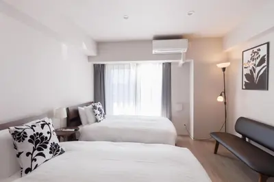 a hotel room with two beds and a window at LANG HOTEL Kameido - Vacation STAY 79534v in Tokyo