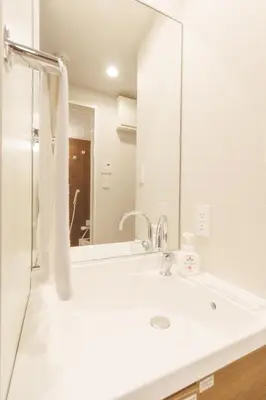 a bathroom with a sink and a mirror at LANG HOTEL Kameido - Vacation STAY 79246v in Tokyo