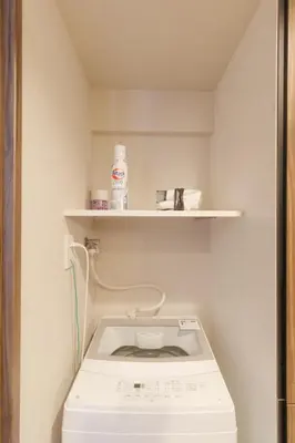 a washing machine in a bathroom with a shelf at LANG HOTEL Kameido - Vacation STAY 79460v in Tokyo