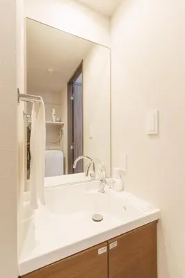a bathroom with a sink and a large mirror at LANG HOTEL Kameido - Vacation STAY 79460v in Tokyo