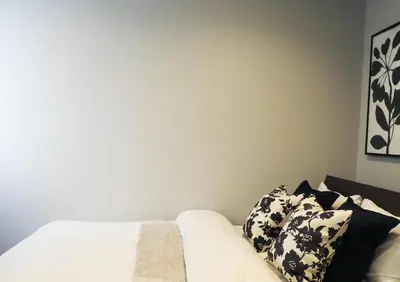 a bedroom with a bed with pillows on it at LANG HOTEL Kameido - Vacation STAY 71097v in Tokyo