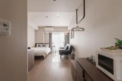 a hotel room with a bed and a living room at LANG HOTEL Kameido - Vacation STAY 76961v in Tokyo