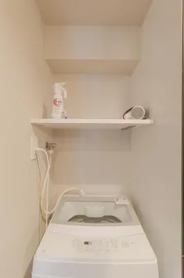a washing machine in a room with a shelf at LANG HOTEL Kameido - Vacation STAY 76961v in Tokyo