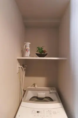 a white toilet in a room with a shelf at LANG HOTEL Kameido - Vacation STAY 76922v in Tokyo