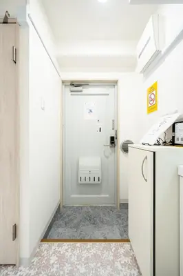 a kitchen with a door leading to a utility room at Ilman Hishimo Mansion - Vacation STAY 19418 in Tokyo