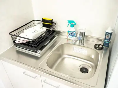 a kitchen sink with a dish rack over it at Ilman Hishimo Mansion - Vacation STAY 19418 in Tokyo