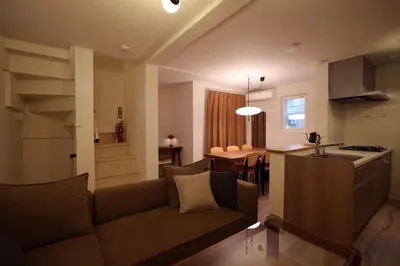 a living room with a couch and a kitchen at Nakano-ku - House - Vacation STAY 19255 in Tokyo