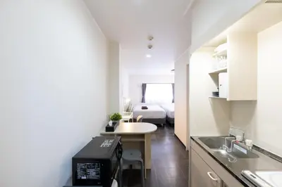 a small kitchen with a small table in a room at Kodenmacho Building Room 201 - Vacation STAY 38318v in Tokyo
