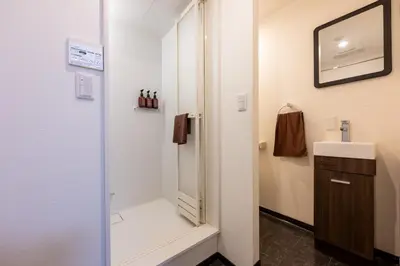 a bathroom with a shower and a sink at Kodenmacho Building Room 201 - Vacation STAY 38292v in Tokyo