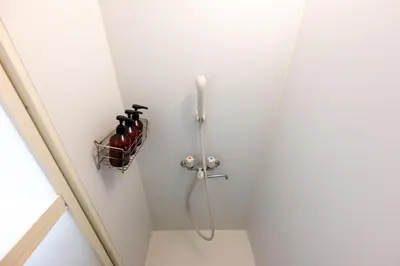 a shower in a bathroom with a bottle holder at Kodenmacho Building Room 201 - Vacation STAY 38324v in Tokyo