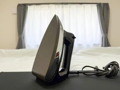 a computer monitor sitting on a table next to a bed at Kodenmacho Building Room 201 - Vacation STAY 38324v in Tokyo