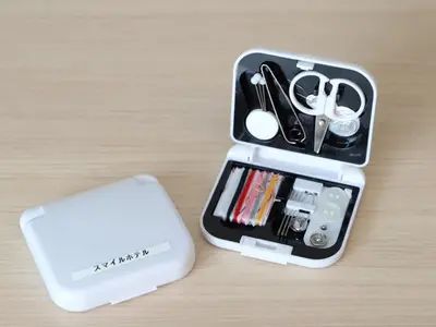 a case with scissors and a cell phone on a table at Smile Hotel Shinagawa Sengakuji Ekimae - Vacation STAY 67645v in Tokyo