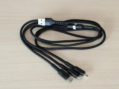 a usb cable sitting on top of a wooden table at Smile Hotel Shinagawa Sengakuji Ekimae - Vacation STAY 67645v in Tokyo