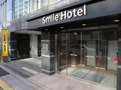 a smile hotel sign on the side of a building at Smile Hotel Shinagawa Sengakuji Ekimae - Vacation STAY 67645v in Tokyo