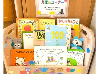 a pile of childrens books in a wooden box at Smile Hotel Tokyo Nishikasai - Vacation STAY 67952v in Tokyo