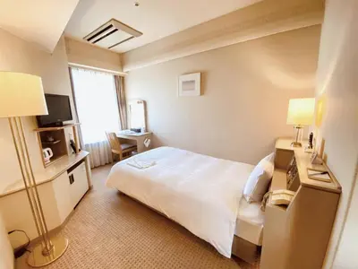 a hotel room with a bed and a television at Smile Hotel Tokyo Nishikasai - Vacation STAY 67938v in Tokyo