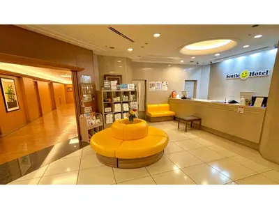 a store with a yellow bench in the middle of a lobby at Smile Hotel Tokyo Nishikasai - Vacation STAY 67954v in Tokyo