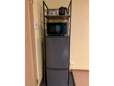 a small refrigerator in a room with a microwave at HOTEL PRELE Asakusa - Vacation STAY 74351v in Tokyo