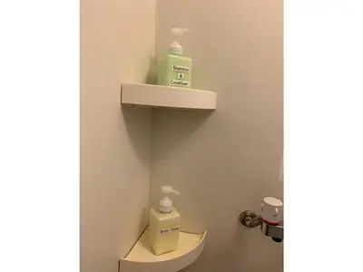 a bathroom with a toilet with two bottles on the wall at HOTEL PRELE Asakusa - Vacation STAY 74351v in Tokyo