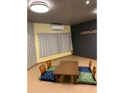 a room with a table and chairs and a window at HOTEL PRELE Asakusa - Vacation STAY 74351v in Tokyo