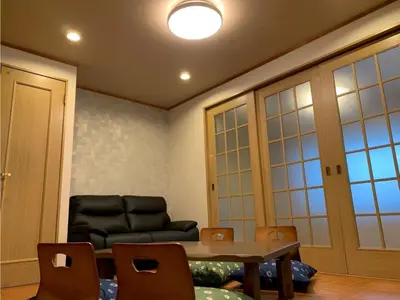 a living room with a table and a couch at HOTEL PRELE Asakusa - Vacation STAY 74363v in Tokyo