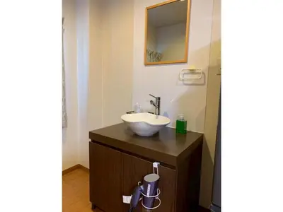a bathroom with a sink and a mirror on a counter at HOTEL PRELE Asakusa - Vacation STAY 74363v in Tokyo