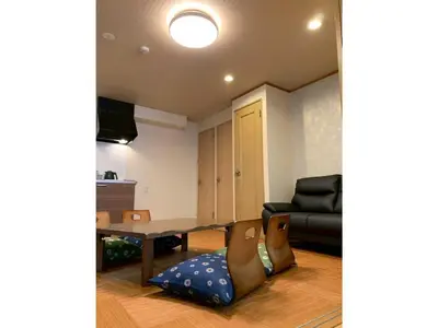 a living room with a table and a couch at HOTEL PRELE Asakusa - Vacation STAY 74363v in Tokyo