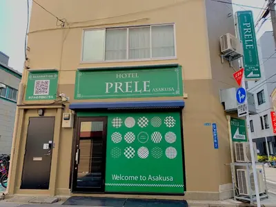 a store with a green sign on the side of a building at HOTEL PRELE Asakusa - Vacation STAY 74363v in Tokyo