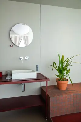 a bathroom with a sink and a mirror at SOIL Nihonbashi Hotel in Tokyo