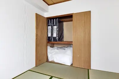 a cabinet in a room with a bed in it at \u30bd\u30ec\u30a2\u30fc\u30c9\u9418\u30f6\u6df5 in Tokyo