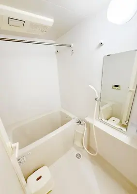a white bathroom with a toilet and a mirror at \u9326\u7cf8\u753a\u30fc804 in Tokyo