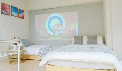 a white bedroom with two beds and a large window at \u9326\u7cf8\u753a\u30fc804 in Tokyo