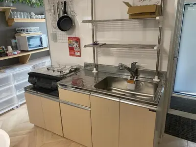 a kitchen with a sink and a counter top at Tokyo Skytree Tower - Asakusa Auberge de Jeunesse in Tokyo