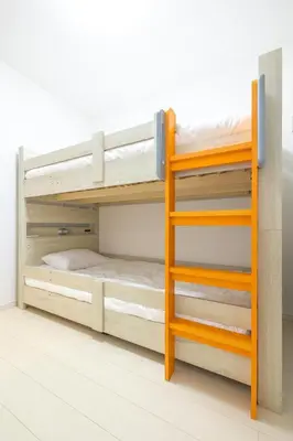 a bunk bed room with two bunk beds and a ladder at Near Shinjuku 3 stops in Tokyo