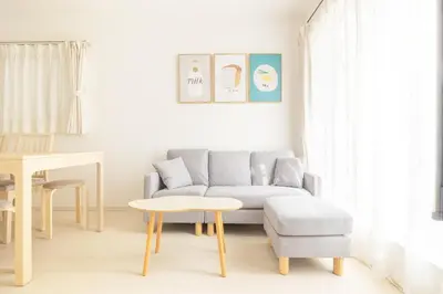 a living room with a couch and a table at Near Shinjuku 3 stops in Tokyo