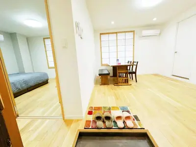 a room with a room with a bed and a table at \u6587\u4eachouse 202 in Tokyo