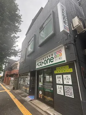a building with signs on the side of it at \u6587\u4eachouse103 in Tokyo