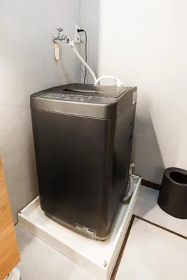 a television sitting on a shelf in a room at 8 min walk to station 11 min to HND airport 85 sqm max 8 people full renovation 2 toilets Netflix in Tokyo