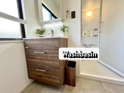 a bathroom with a wooden dresser and a sink at \u767d\u5c71\u30ed\u30a4\u30e4\u30eb\u30cf\u30a6\u30b9 in Tokyo