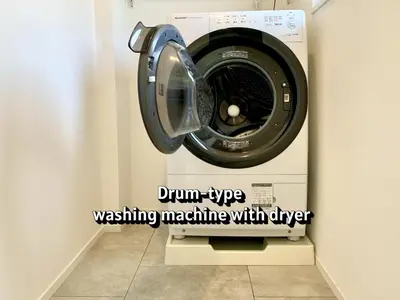 a washing machine with the words drum type washing machine withgee at \u767d\u5c71\u30ed\u30a4\u30e4\u30eb\u30cf\u30a6\u30b9 in Tokyo