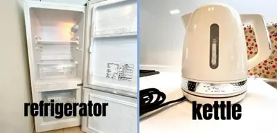 a refrigerator with its door open and a kettle next to it at \u767d\u5c71\u30ed\u30a4\u30e4\u30eb\u30cf\u30a6\u30b9 in Tokyo