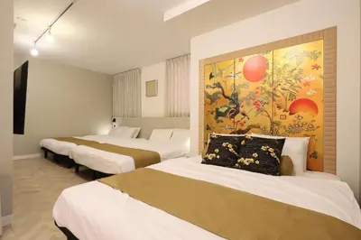 a room with four beds and a painting on the wall at Japanese Modern House Aakasaka-Mitsuke St 2min Shibuya Shinjuku 9min in Tokyo