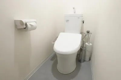 a white toilet in a bathroom with a roll of toilet paper at Japanese Modern House Aakasaka-Mitsuke St 2min Shibuya Shinjuku 9min in Tokyo