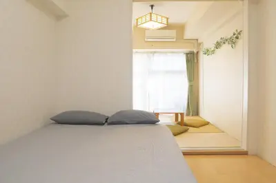 a bedroom with a bed and a window at Kabukicho 507-SJ0011 in Tokyo