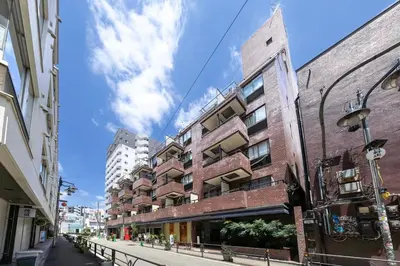 an empty street in a city with buildings at Feel Stay\u9053\u7384\u5742506 in Tokyo
