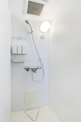 a shower with a shower head in a bathroom at Feel Stay\u9053\u7384\u5742506 in Tokyo