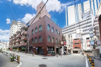 a brick building on a street in a city at Feel Stay\u9053\u7384\u5742506 in Tokyo