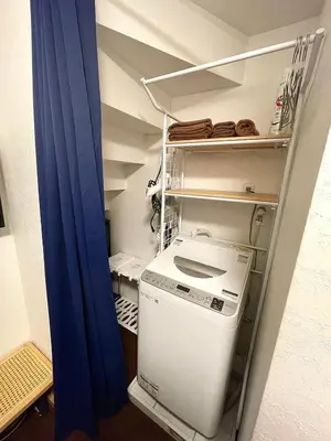 a small kitchen with a washing machine in a room at n'imo HOUSE 101 in Tokyo
