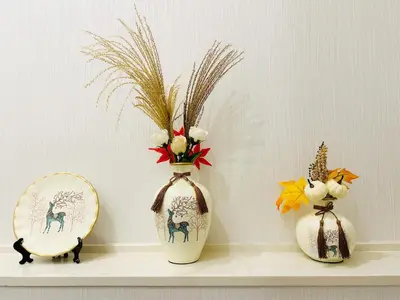 three vases on a shelf with a mirror and flowers at Uenoyuyunoie - Vacation STAY 19367 in Tokyo