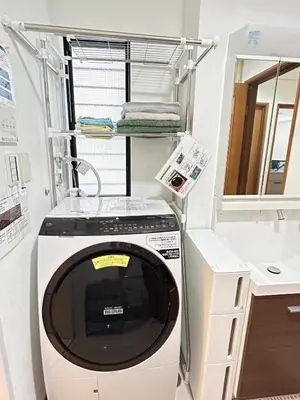 a washing machine in a bathroom with a shelf at GreatViewHouse - Vacation STAY 19425 in Tokyo